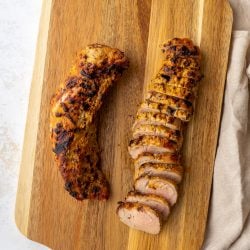 sliced pork tenderloin on a cutting board
