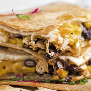 straight on shot of stack of sheet pan quesadillas