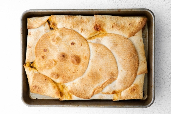 browned quesadillas on a sheet pan