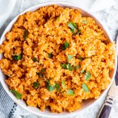 overhead of spanish rice in a white serving bowl