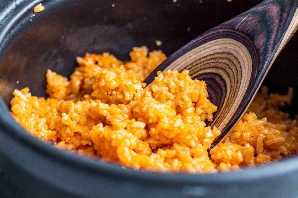 wooden spoon with spanish rice 