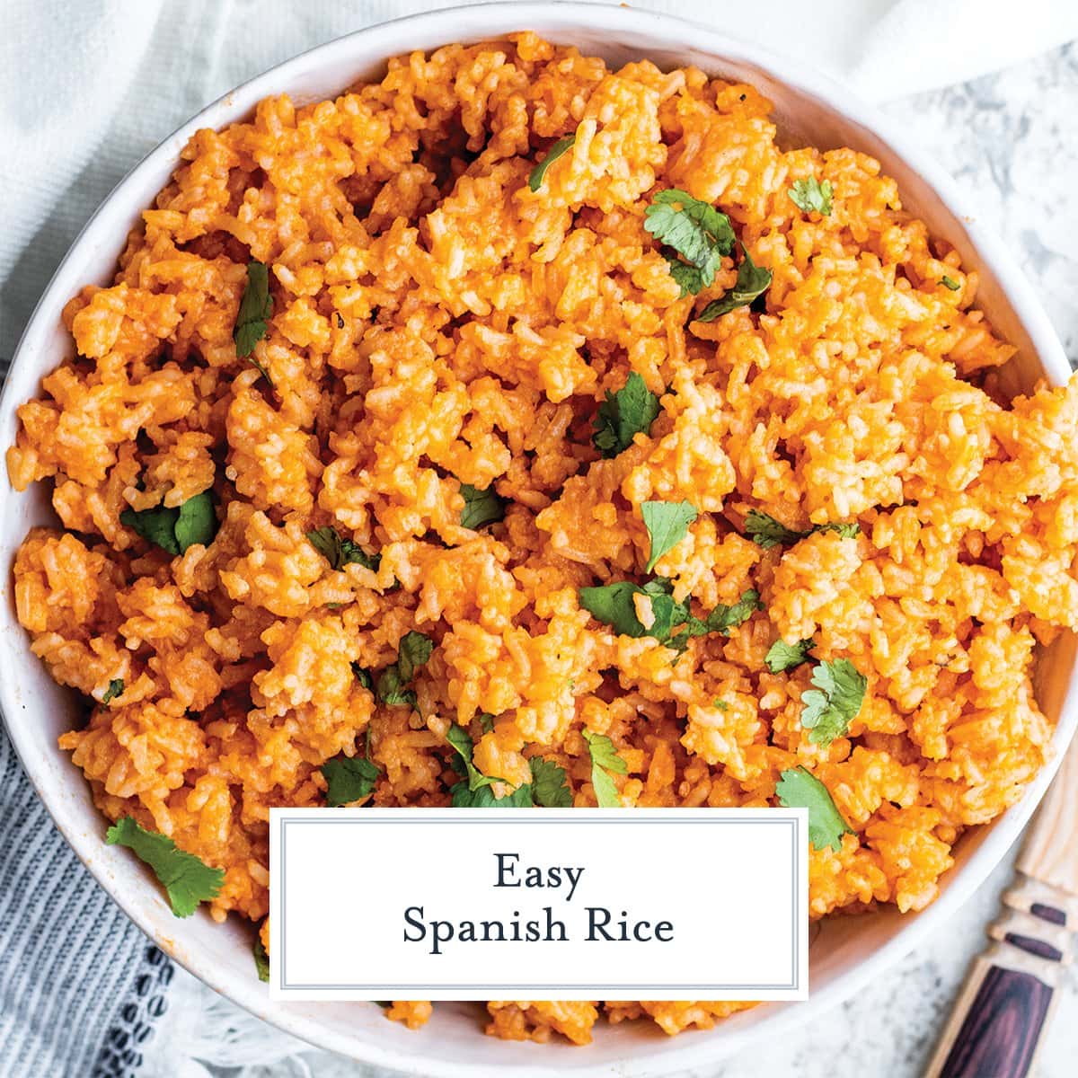 close up bowl of spanish rice topped with fresh cilantro 