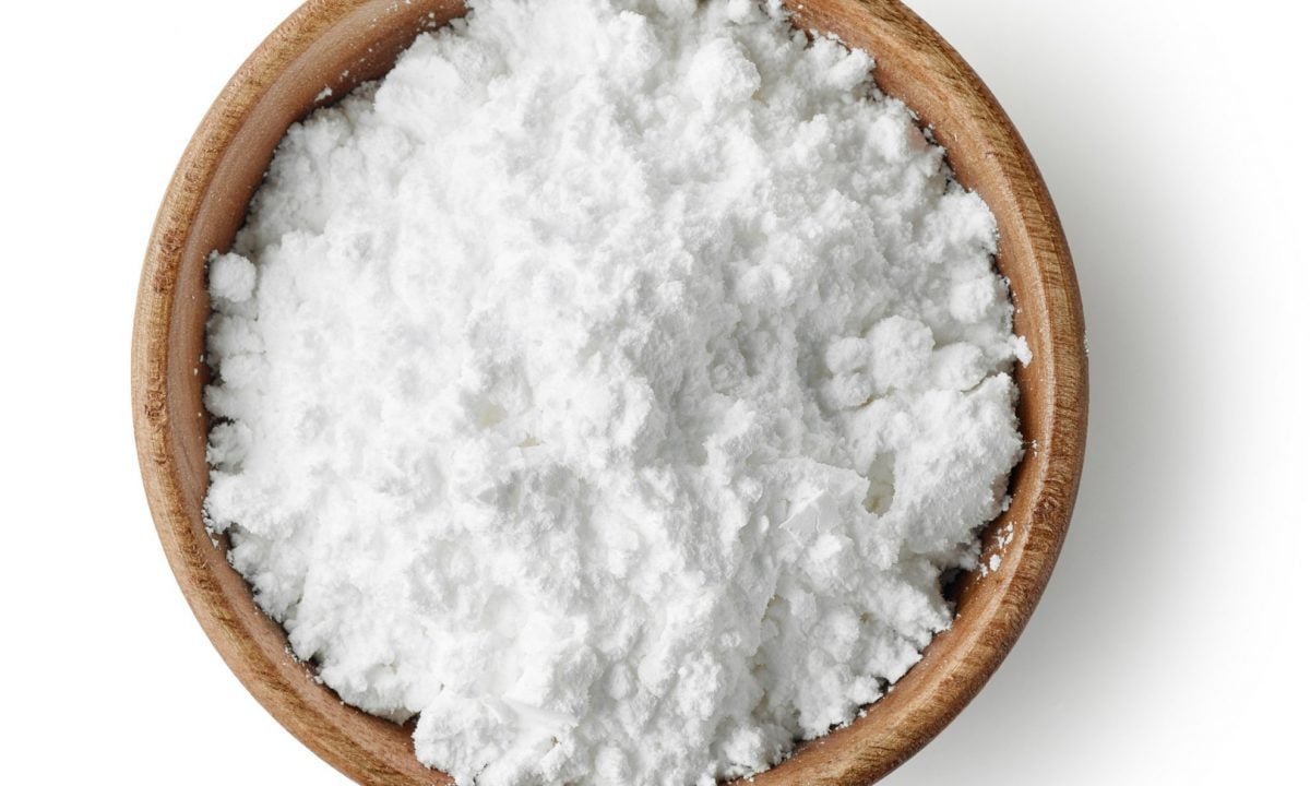 wooden bowl of powdered sugar