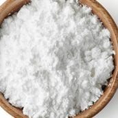 wood bowl of powdered sugar