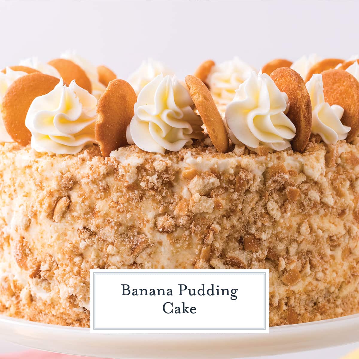 close up of nilla cookie crumbs on banana pudding layer cake 