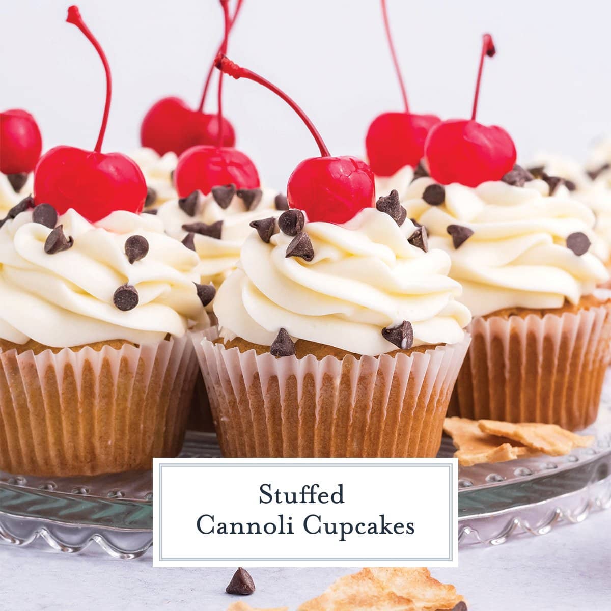 close up of cannoli cupcakes with chocolate chips and a cherry 