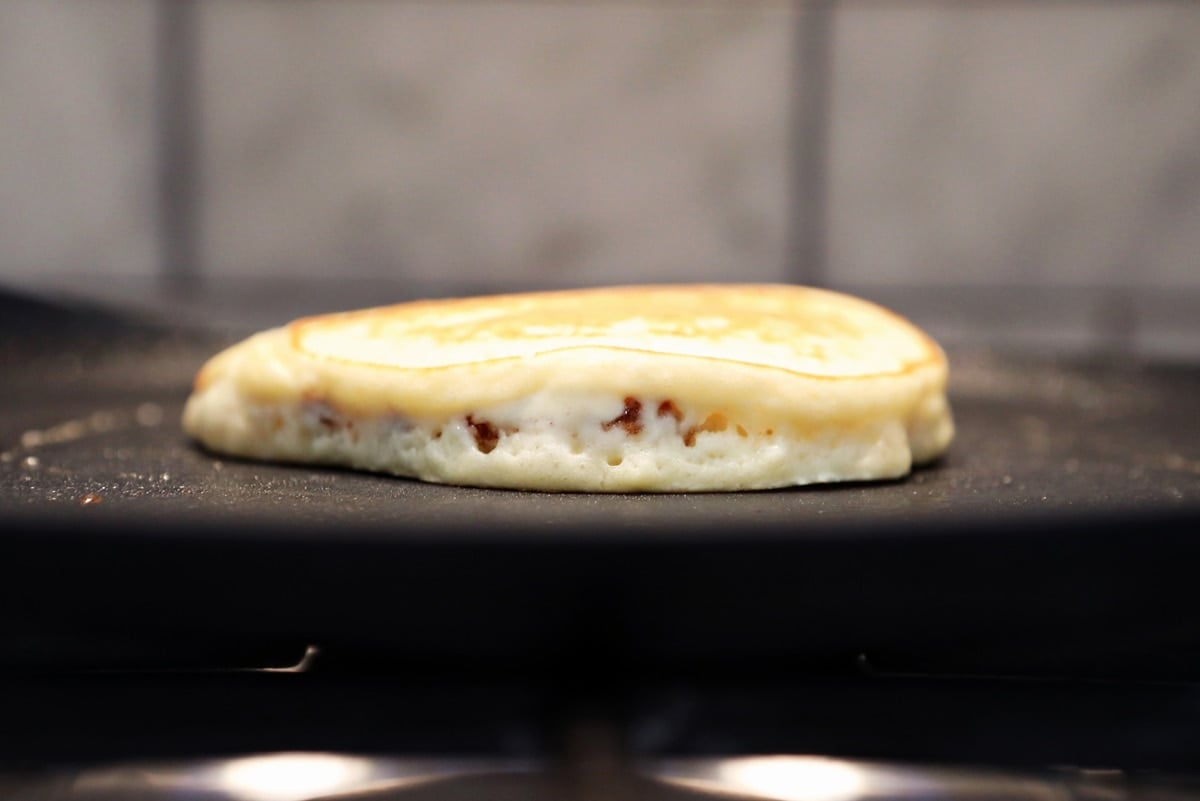 side view of pancake on a griddle 
