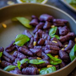 angled shot of sweet potato gnocchi in bowl