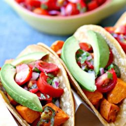 sweet potato tacos with avocado in a holder