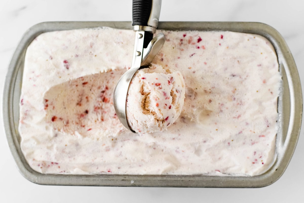 scooping strawberry ice cream 