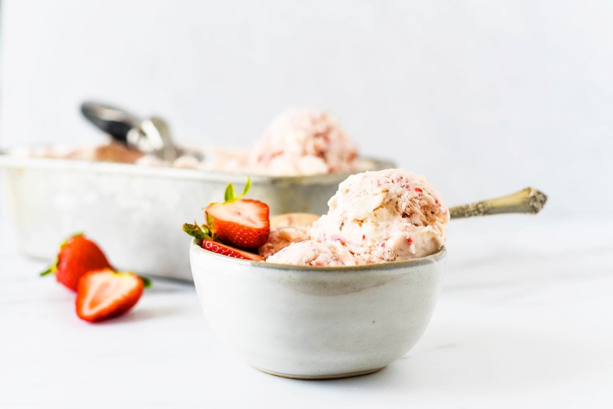side view no churn strawberry ice cream in a bowl 
