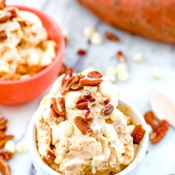 Bowl of sweet potato ice cream with white chocolate chips and nuts