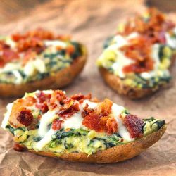 spinach stuffed sweet potatoes on parchment paper