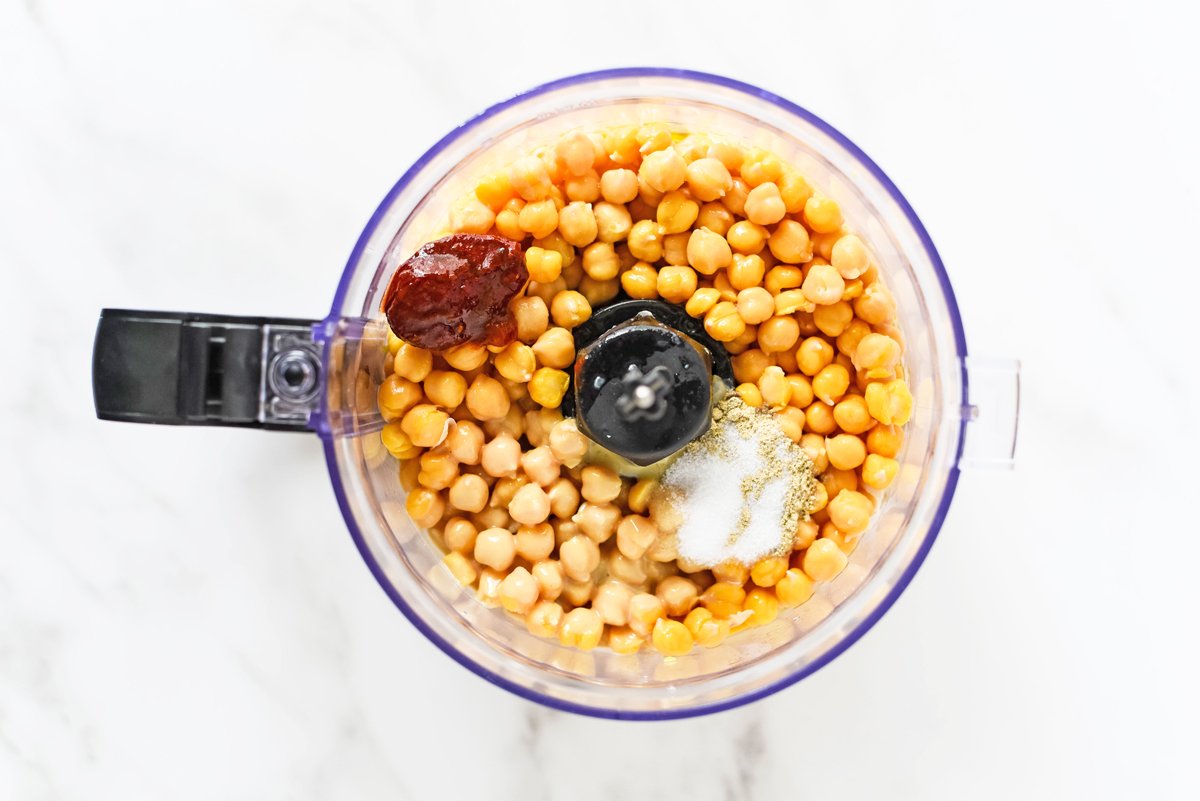 ingredients in a food processor for spicy hummus 