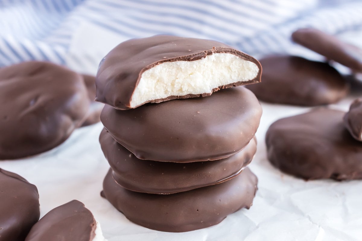 stack of peppermint patties with one broken in half  