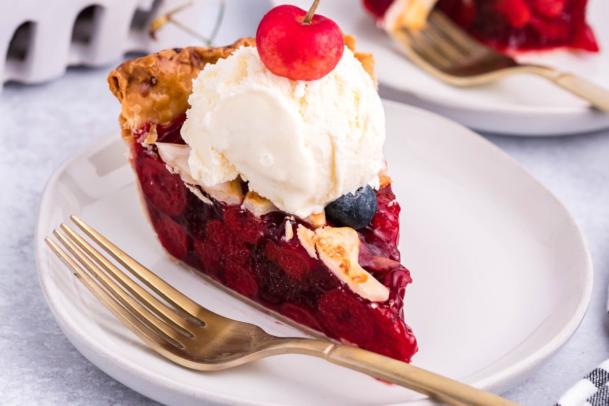 slice of cherry pie with ice cream