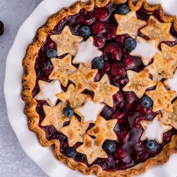 overhead of cherry pie with stars