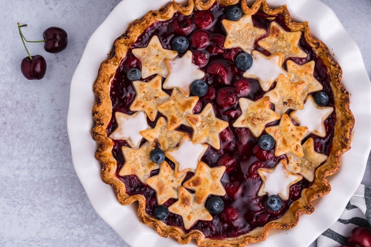 overhead of cherry pie with stars