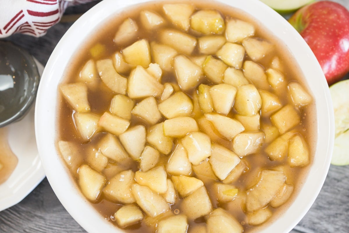 overhead of apple pie filling in a white bowl 