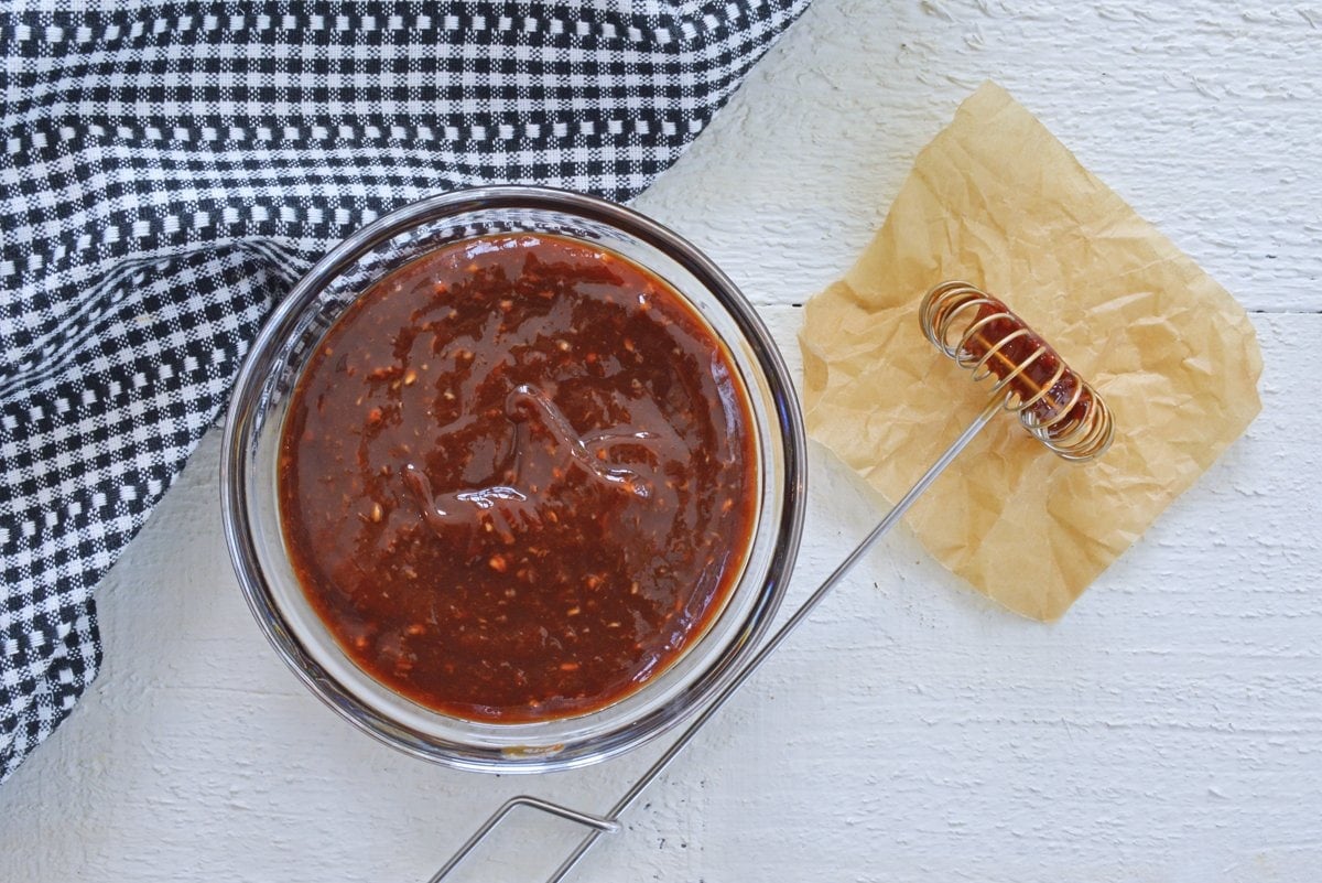 overhead of balsamic cocktail sauce with a whisk 