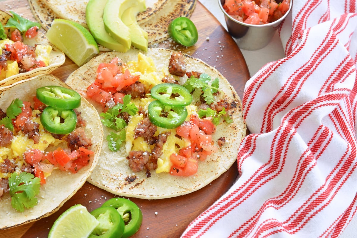 angle view of breakfast tortilla with eggs, sausage, pico and jalapeno
