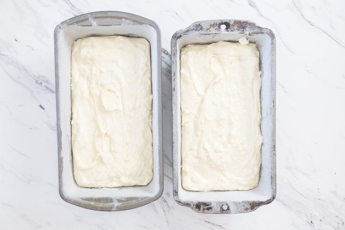 coconut pound cake batter in two loaf pans 