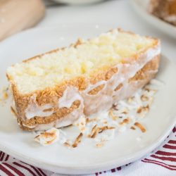 close up slice of coconut cream pound cake with drizzle