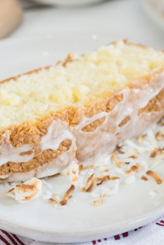 close up slice of coconut cream pound cake with drizzle