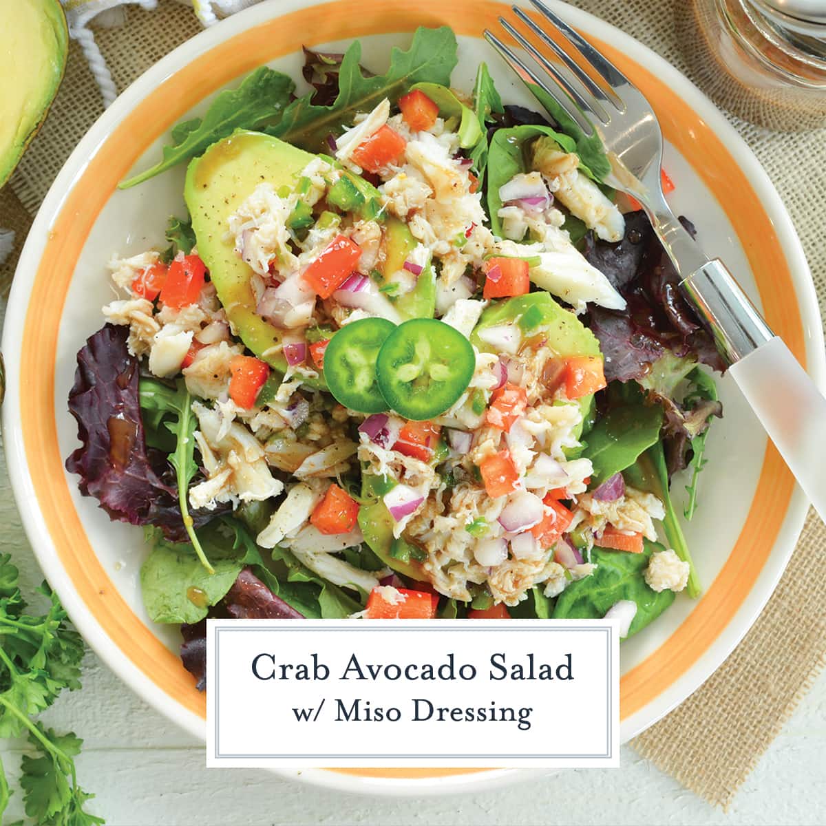 close up overhead of crab avocado salad with jalapeno slices 