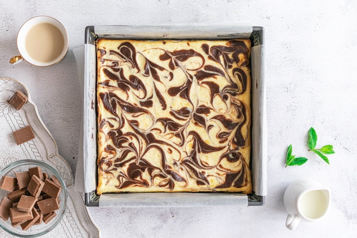 swirled brownies in a square baking pan 