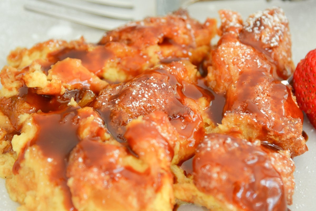 close up of served bread pudding with a sauce 