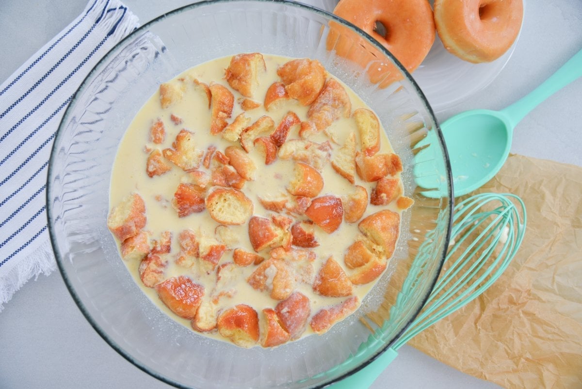 donut pieces floating in a custard sauce 