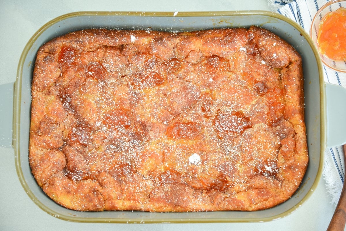overhead of casserole dish with powdered sugar bread pudding  