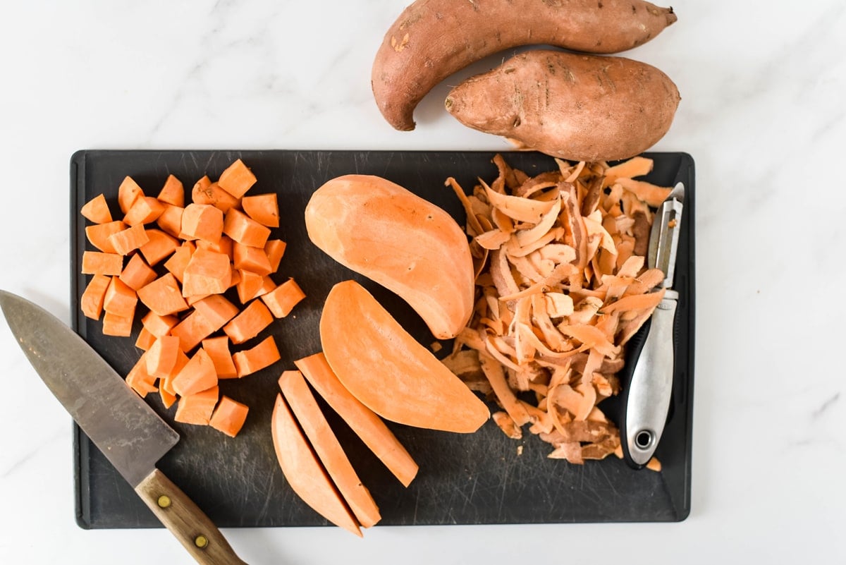 sweet potatoes on a cutting board 