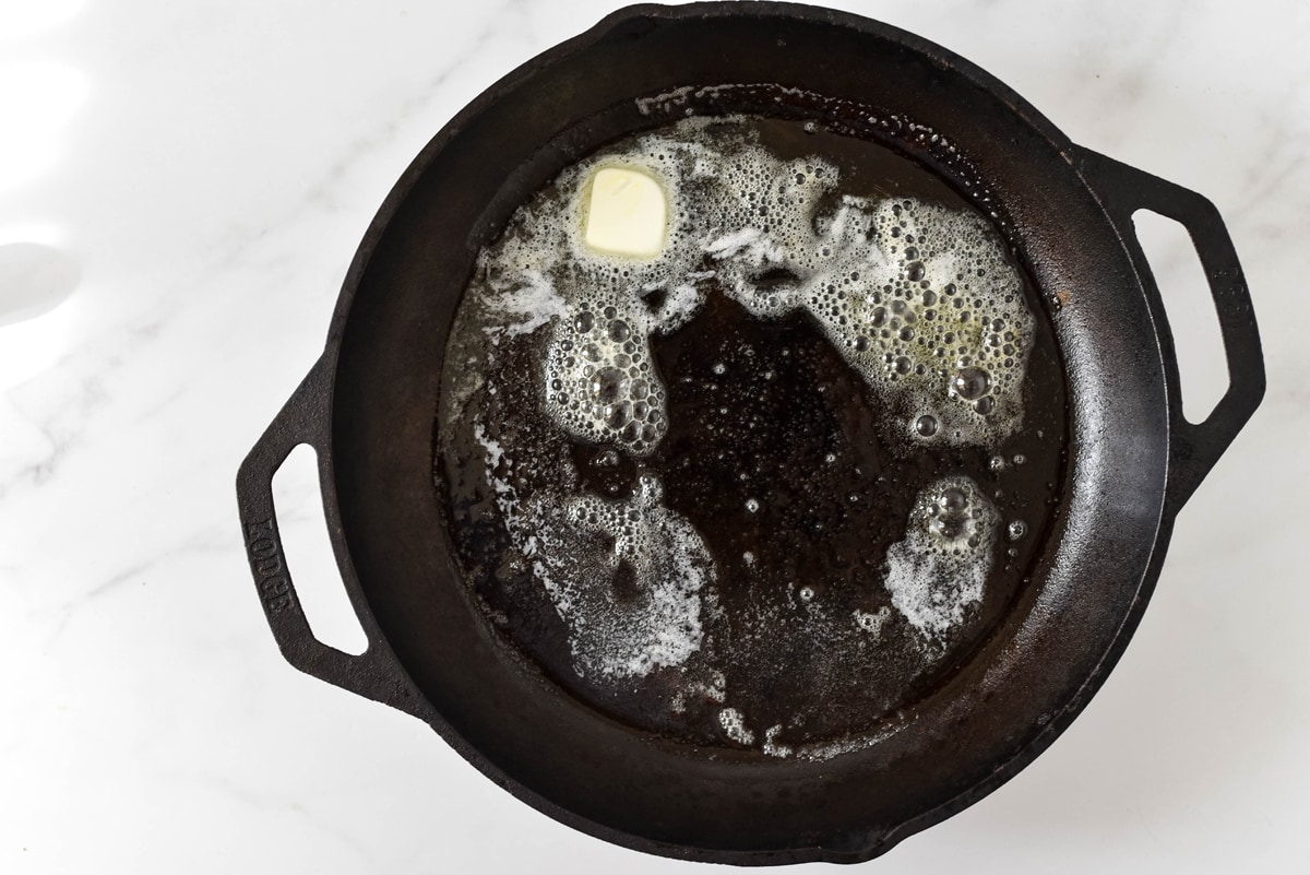 melted butter in a cast iron pan 