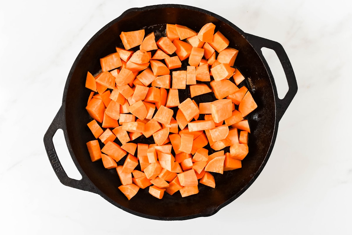 diced sweet potatoes in a skillet 