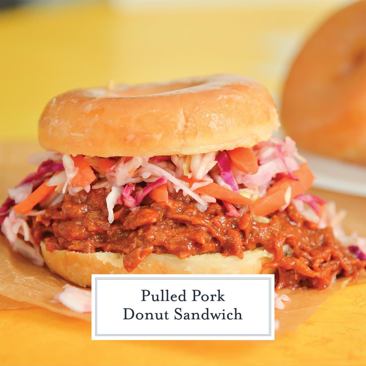 close up of a pulled pork donut sandwich with coleslaw