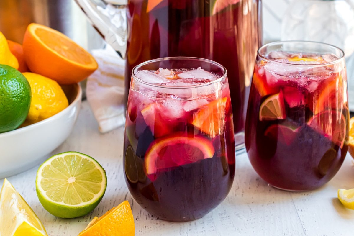 side view of red wine sangria with fruit 