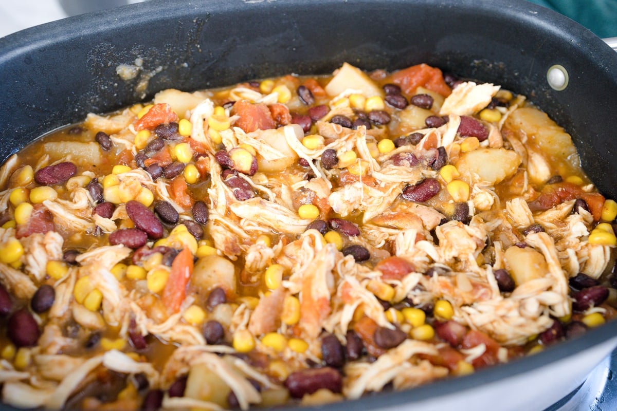 angle view of shredded chicken in a crockpot 