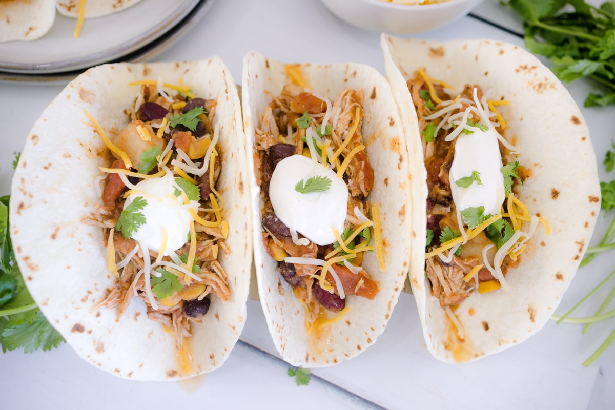 overhead of three prepared soft tacos 