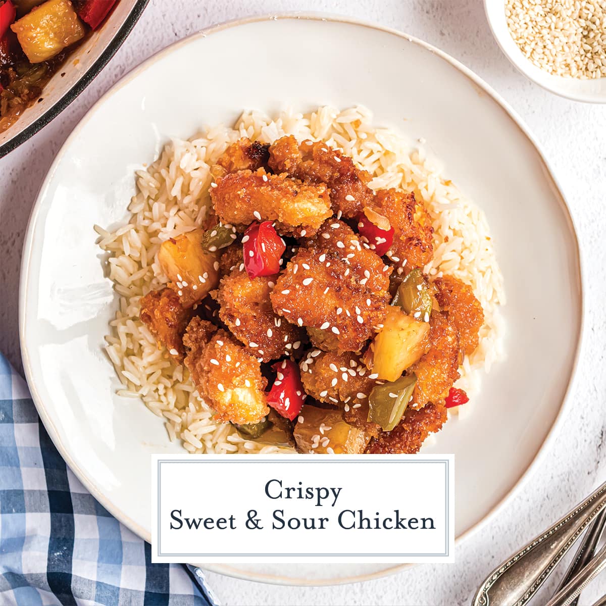 overhead white plate of sweet and sour chicken over rice 
