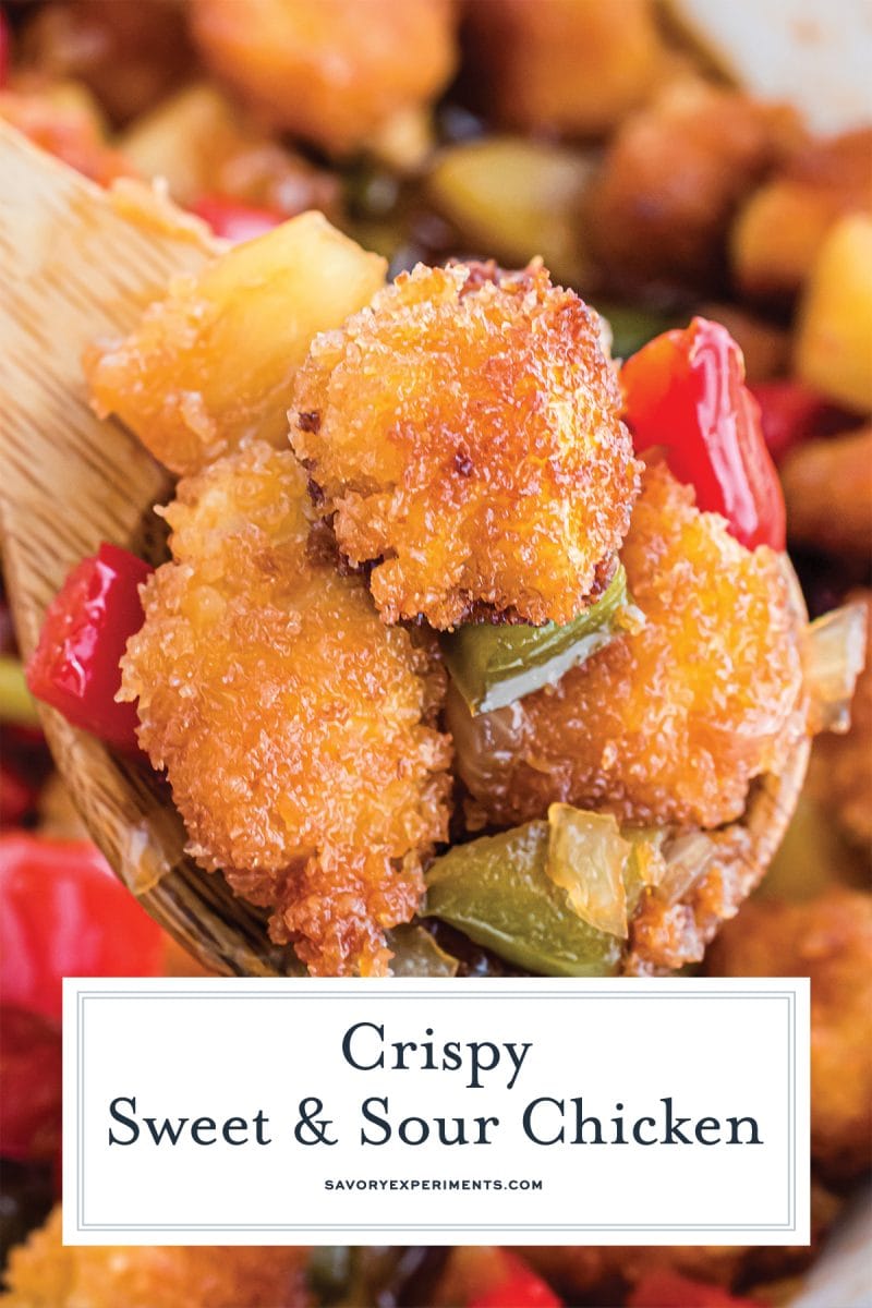 close up of sweet and sour chicken on a spoon