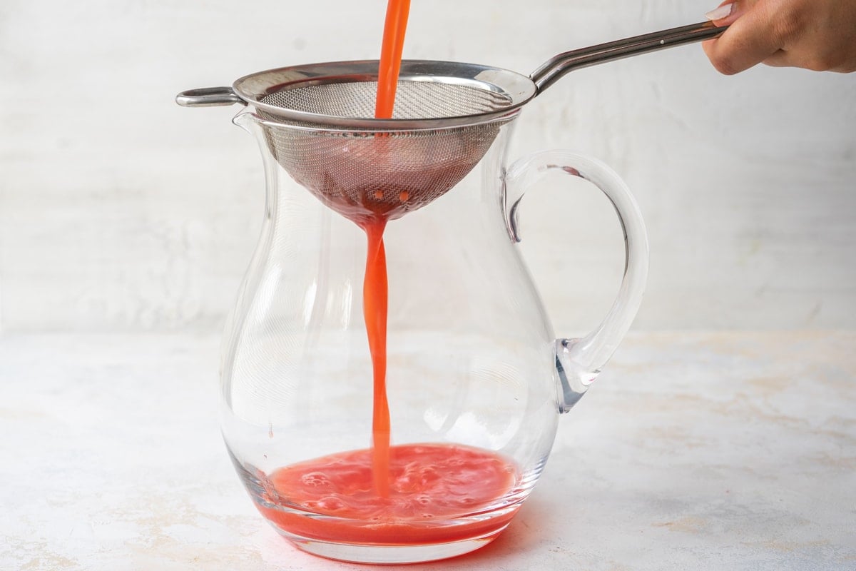 watermelon juice being strained 