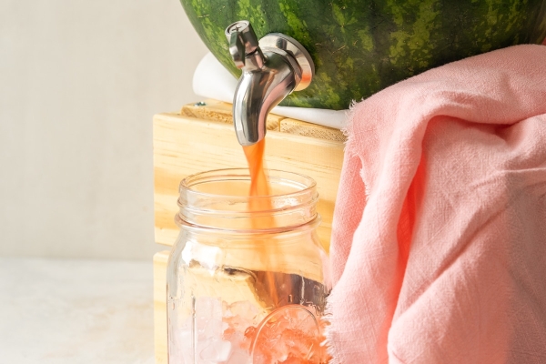juice flowing from a watermelon keg