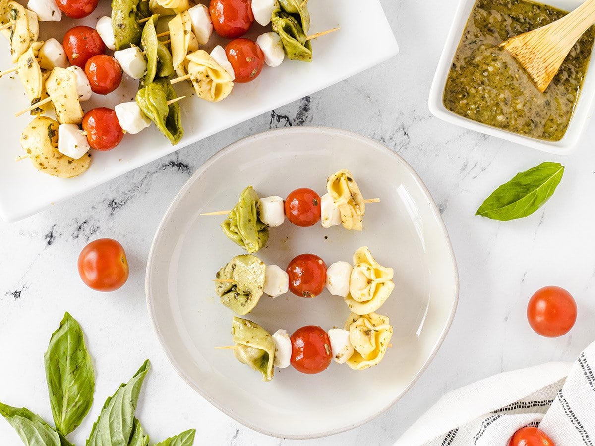 overhead of tortellini kabobs on a plate 