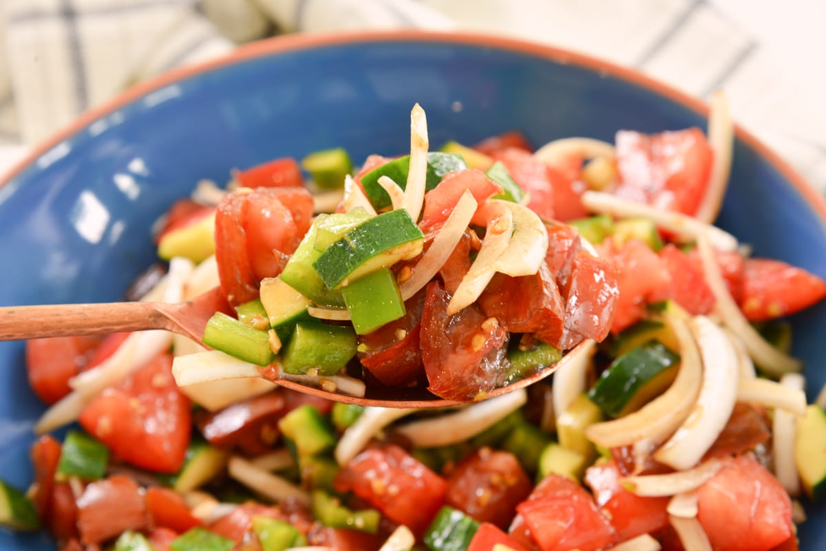 spoon of cucumber tomato salad 