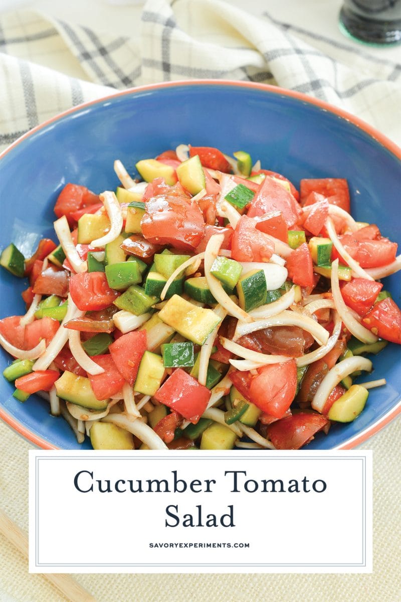 close up of cucumber tomato salad in a blue bowl 