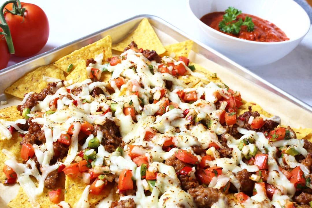 angle close up of melted cheese on italian nachos 