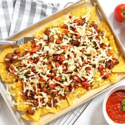 overhead of italian nachos on a sheet pan