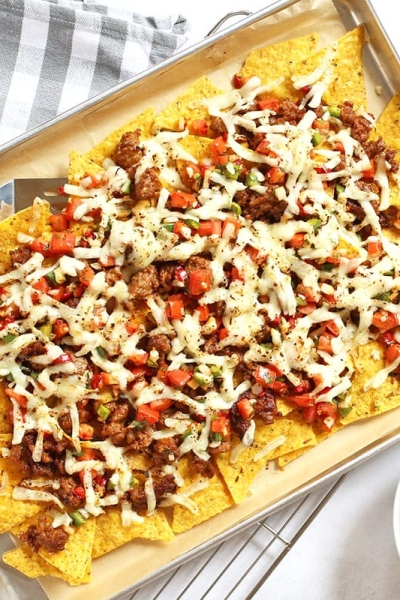 overhead of italian nachos on a sheet pan